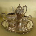 A silver-plated tea tray and three piece silver-plated tea service