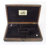 An A J. Burrow mahogany two pistol case, 19th Century Mahogany lid with gun makers name J.