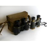 A cased pair of WWII military issue binoculars Kershaw binoculars in a canvas case by Finnigans Ltd