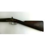 A double barrelled side by side percussion cap shotgun,