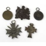 A collection of Nazi Germany WWII medals To include silver mothers cross dated 1938,