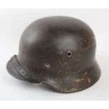 A Nazi Germany WWII M1940 helmet Steel helmet with leather insert, chin strap,