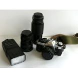 A Canon AE-1 camera With zoom lens 70-210mm, Canon 277T Speedlite,