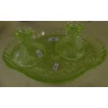 A 1930s Uranium glass dressing table tray and pair of candlesticks