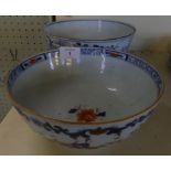 Two 19th Century Chinese circular footed bowls, one decorated in blue and white, the other with