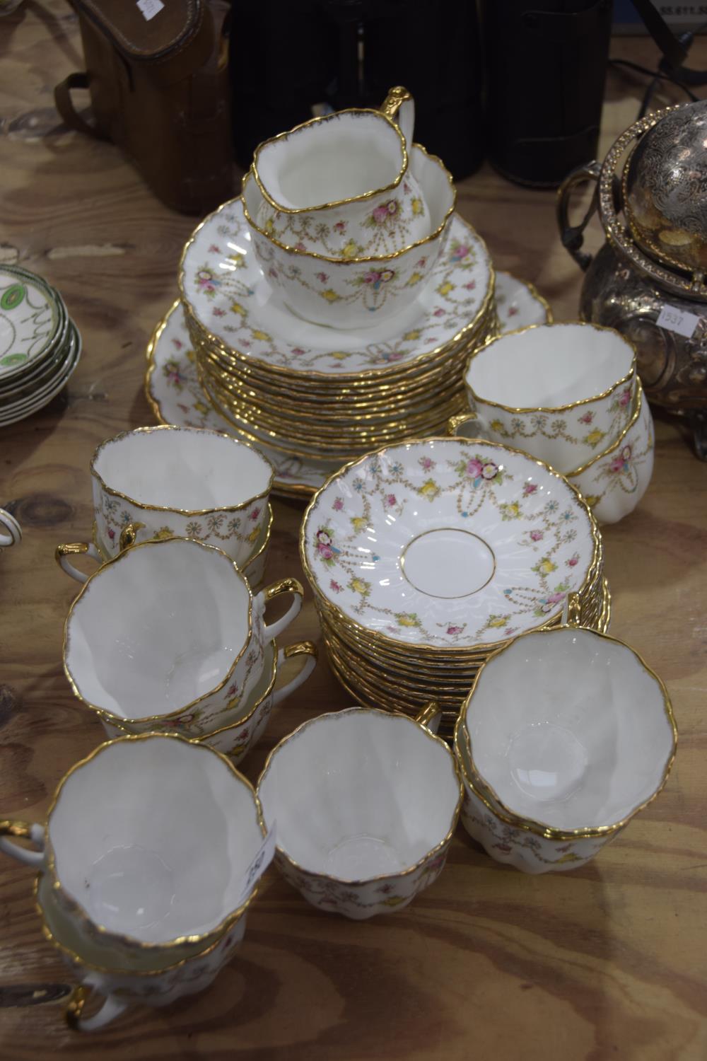A Salisbury "Bow" pattern porcelain tea service Comprising eleven various teacups, twelve saucers,