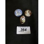 Three brooches to include a shell cameo brooch and two enamel brooches (3)