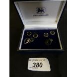 A cased set of silver and onyx cufflinks and dress studs
