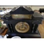 A Victorian mantel clock in black slate and marble architectural case, bearing presentation plaque