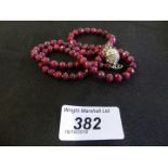 A ruby bead necklace, the faceted ruby beads with a magnetic paste clasp, length 52.5cm