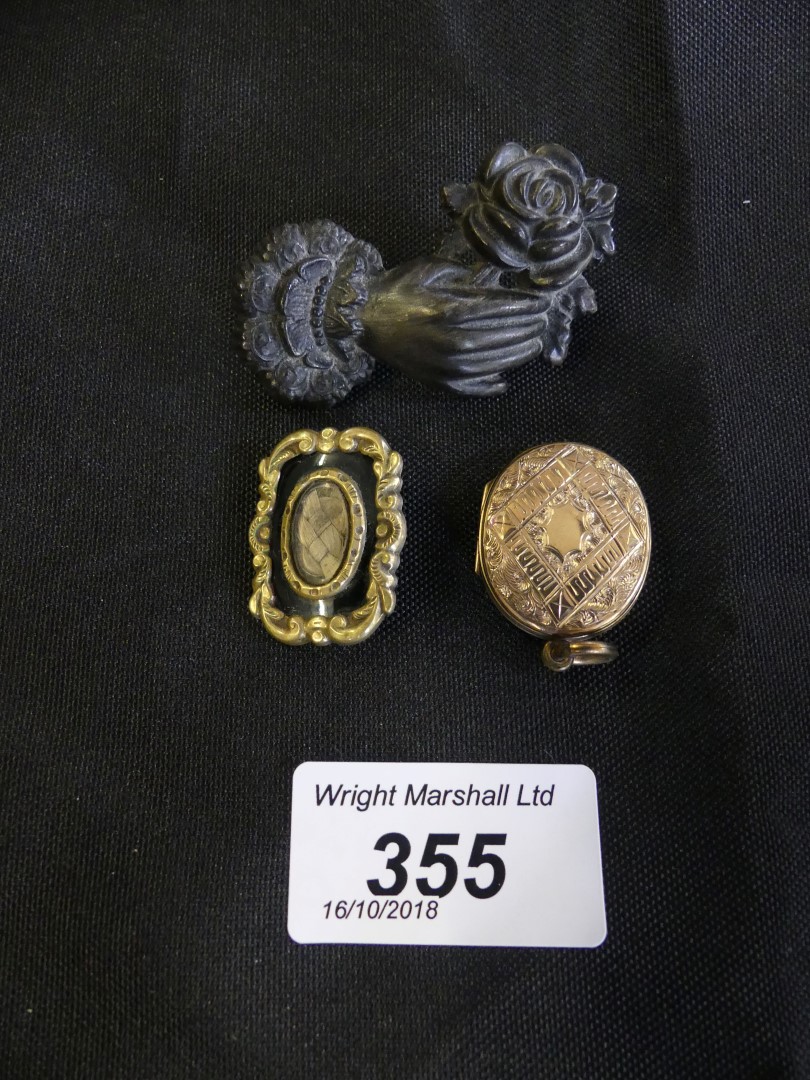 A selection of memorial jewellery to include a late Victorian enamel brooch with glazed hair