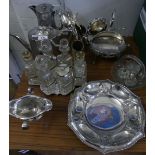 A mixed lot of silver-plated items comprising tea wares, six bottle cruet, various cutlery's and