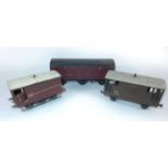 Three unboxed good quality 'O' gauge items Comprising large closed cattle wagon and two guards