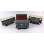 Four good quality unboxed 'O' gauge wagons Comprising open and closed wagons in Midland livery, fish