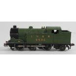 An unboxed Hornby Dublo three-rail EDL7 0-6-2 tank locomotive No. 9596 in green LNER livery An