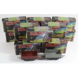 Thirteen boxed Graham Farish '00' gauge wagons In various liveries including one break van, all in