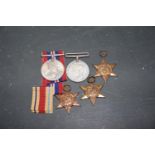 A boxed WWII medal group awarded to Mr S Jamison Comprising 1939-1945 Star, Africa Star, Italy Star,