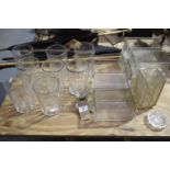 A collection of various glass items To include a rectangular glass acid measurement vessel, eight