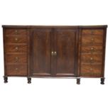 A large and impressive Regency mahogany breakfront linen press, possibly Scottish Having a moulded