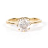 A 9ct gold paste solitaire ring Designed as a circular shape white paste, hallmarks for Sheffield,