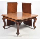 A Victorian mahogany extending dining table The rectangular moulded top with rounded corners above a