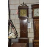 An 18th Century oak cased long case 30 hour clock Having a twin swan neck pediment above tapering