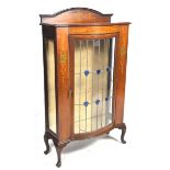 An early 20th Century inlaid mahogany Art Nouveau display cabinet The arched pediment inlaid with