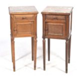 A pair of early 20th Century French walnut and rouge marble bedside cabinets Each cabinet with a