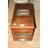 A vintage mahogany cashiers till Of rectangular form with a front drawer applied with a metal cup