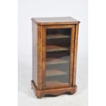 A Victorian burr walnut music cabinet The rectangular crossbanded and canted top above a single