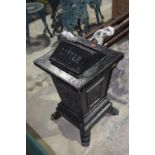 An impressive early 20th Century cast iron litter bin The tilt top cast in relief with 'litter'