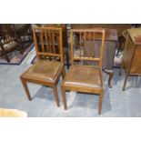 A pair of oak "Acorn Man" dining chairs, mid 20th Century Each chair with an angular back and