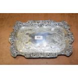 A silver tray Of rectangular outline, with embossed floral decoration and scrolling rim, Henry
