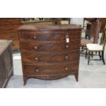 A 19th Century mahogany bowfront chest of drawers With an arrangement of two short and three long