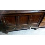 An 18th Century oak mule chest Having three inverted panels above two lower frieze drawers raised