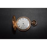 A gold plated hunter pocket watch The white enamel dial signed Waltham, with Roman numeral hour