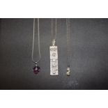 Three necklaces To include a silver ingot pendant, an imitation pearl pendant and one other, total