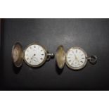 Two silver hunter pocket watches Each opening to reveal a white enamel dial with Roman numeral