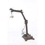 An unusual contemporary cast iron lamp base The base formed from a cast iron plinth extending to