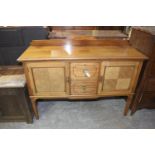 An early 20th Century mahogany sideboard With a rectangular moulded top above two central drawers