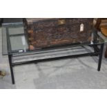 A 1960/1970's contemporary glass top coffee table The rectangular glass top raised upon a painted