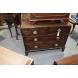 A Georgian mahogany chest of drawers Having two short drawers and one long drawer, raised upon