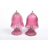 An unusual near pair of early 20th Century mushroom shaped cranberry glass table lamps Each lamp