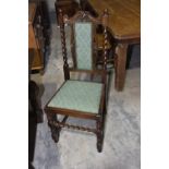 A 1930's oak draw leaf dining table and four oak barley twist dining chairs The square draw leaf