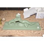 A mid 20th Century Art Deco style plaster figure group The repainted figure depicting a scantily