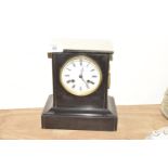 A Victorian slate mantle clock Having a 10cm enameled white dial painted with Roman numerals and the