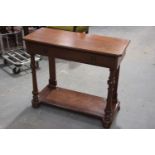 A Victorian mahogany side table Having a rectangular top canted front corners above a single