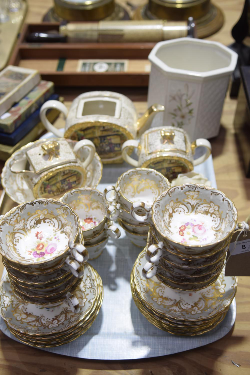 A tea service, 20th Century To include 12 breakfast cups, seven teacups, 12 plates and a fruit