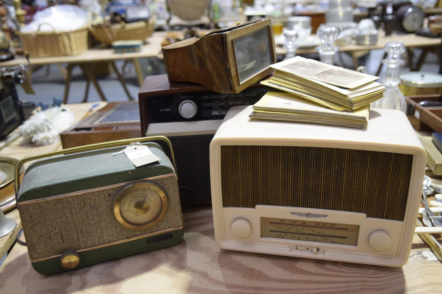 A group of three vintage radio's The first Bush radio VHF 81 (24cm high), the second a Baird