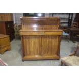 A Mid 19th Century rosewood chiffonier The raised panel back with a single shelf supported on turned